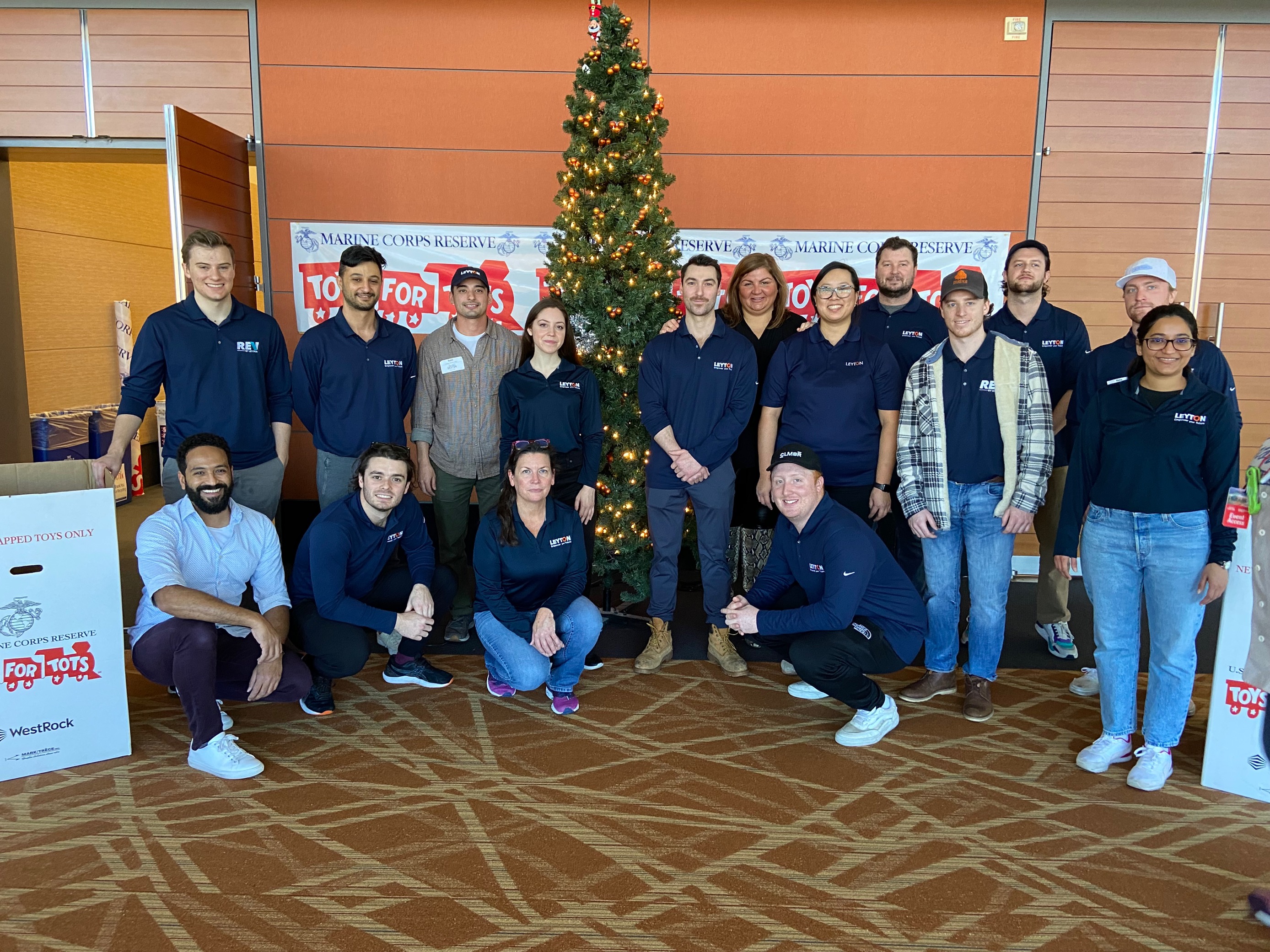 Group photo of Leyton team at a Toys for Tots Christmas event.