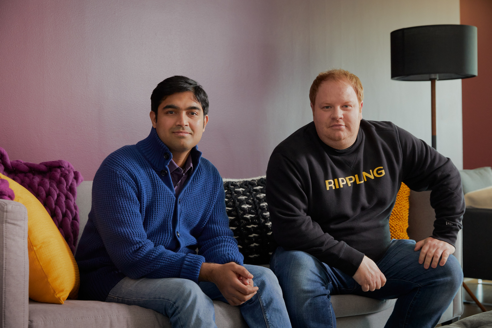 Rippling co-founders Prasanna Sankar (left) and Parker Conrad (right) pose together for a photo.