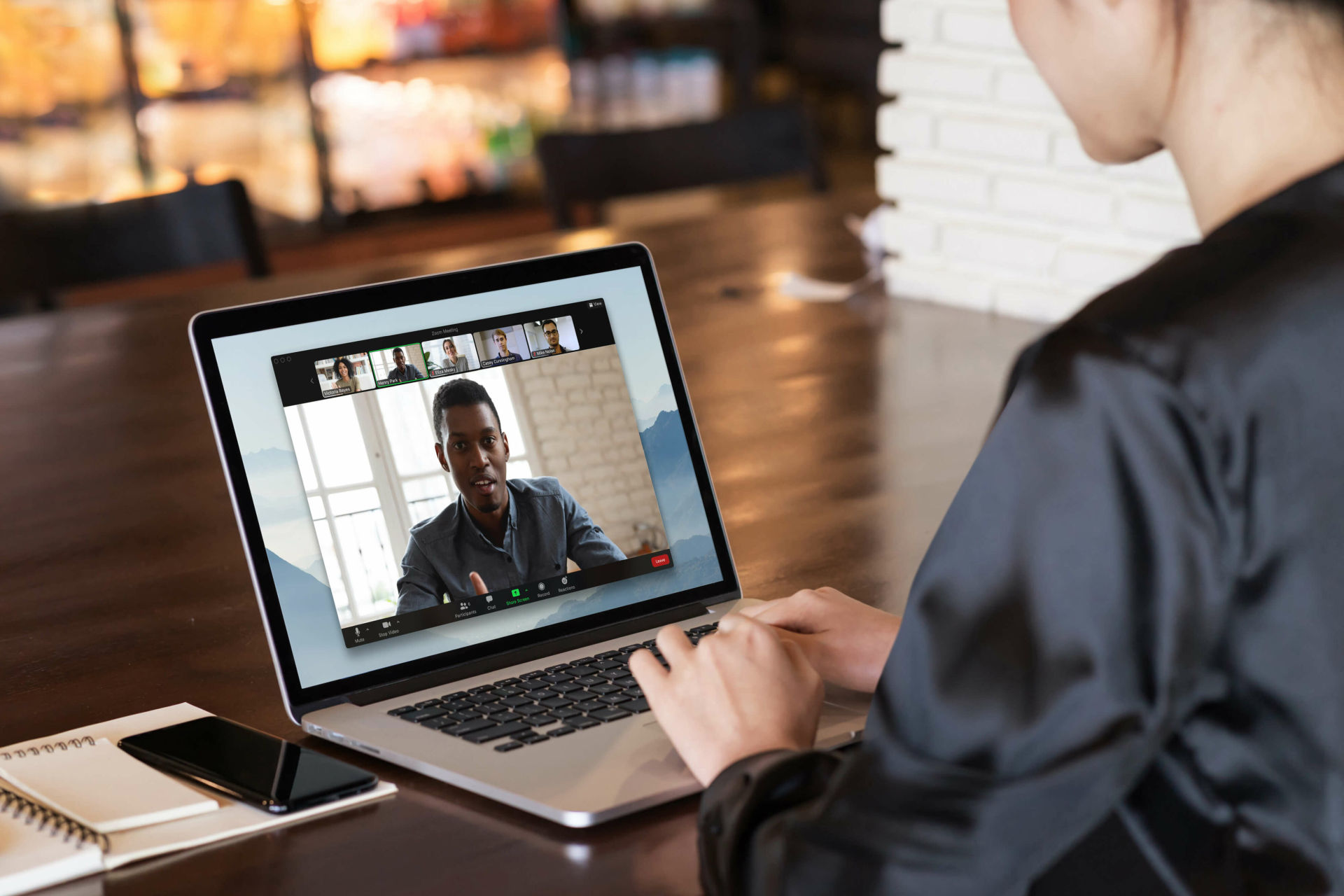 Image of a woman participating in a video conference call on a laptop