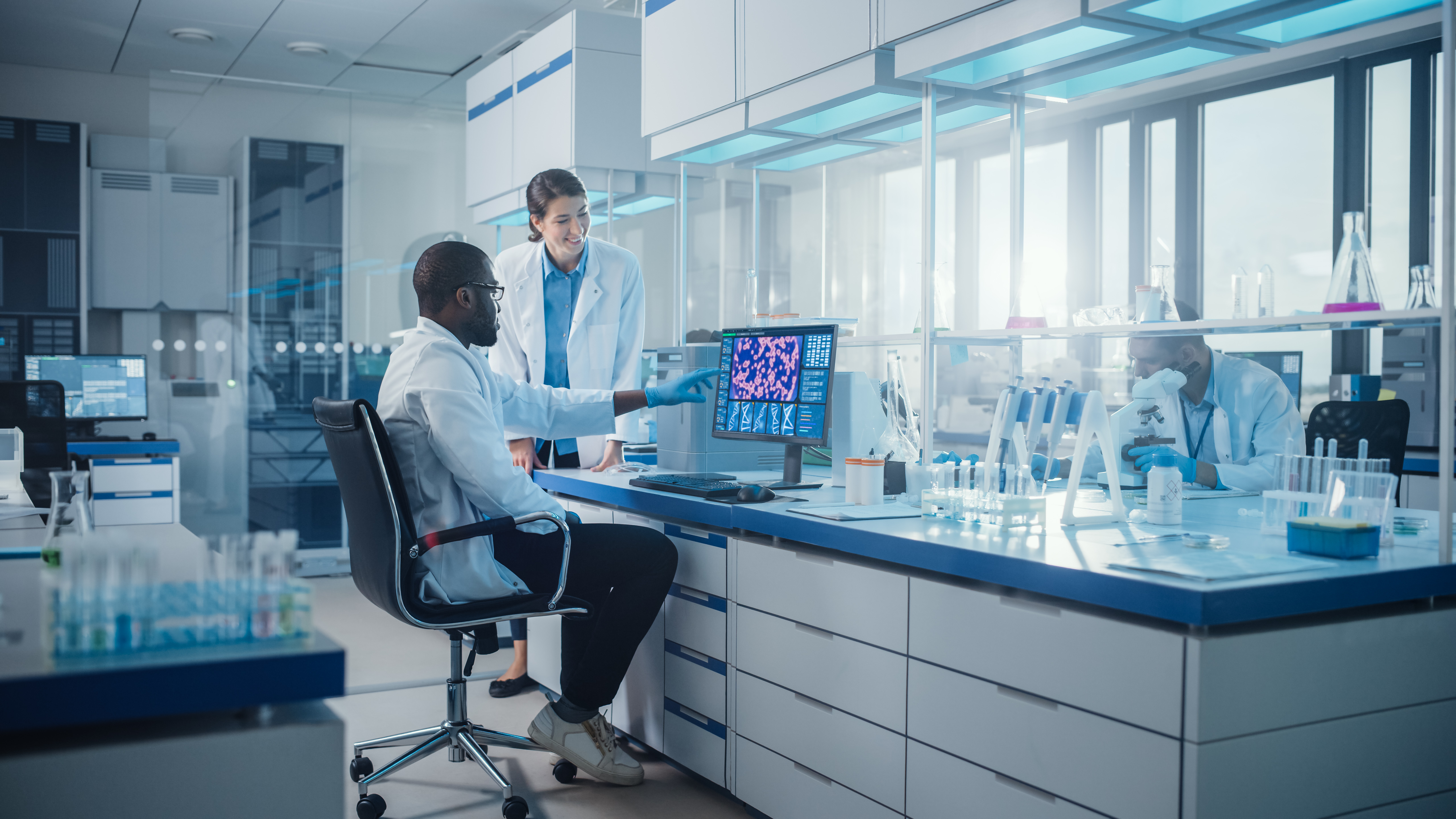 stock image of two people working in a high-tech lab