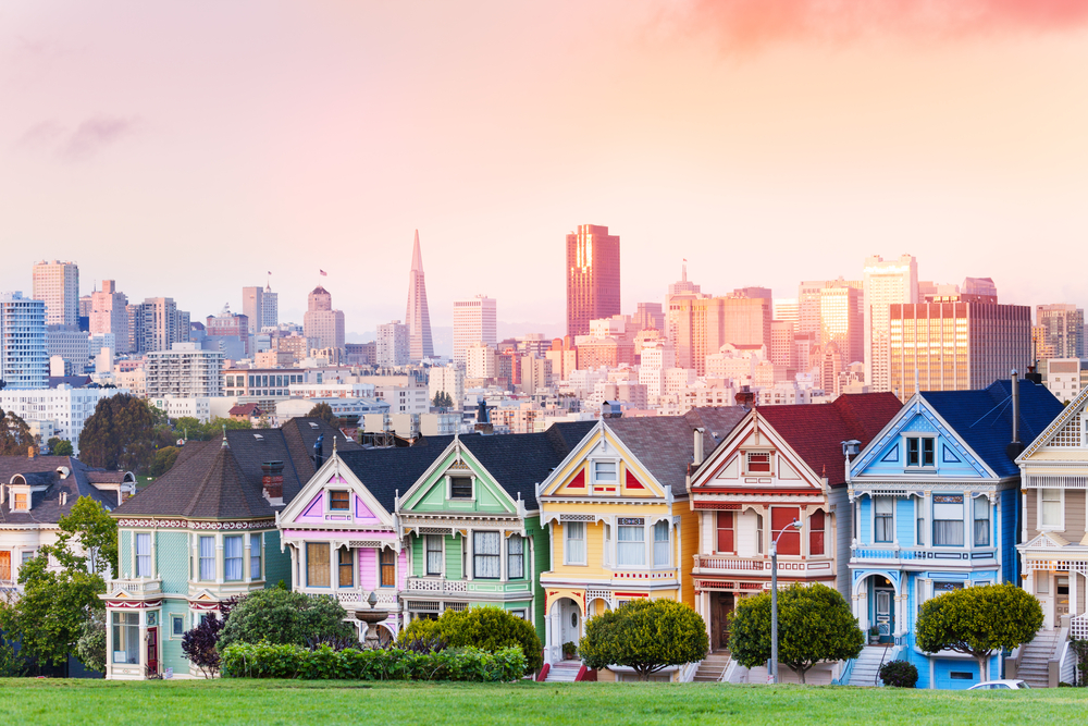 The Painted Ladies stand upon a hill in San Francisco.