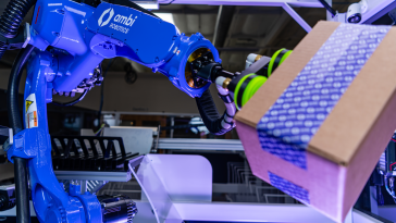 Ambi Robotics' AmbiSort A-Series robot picks up a parcel