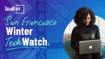 A woman on her laptop browsing Built In SF's list of Winter Tech Watch companies.