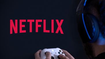 A person holding a gaming controller with the Netflix logo on the TV.
