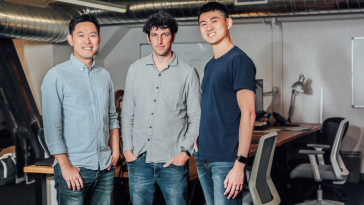 Upduo's founding team poses together for a photo in the office.