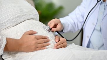 A pregnant patient receives a checkup.